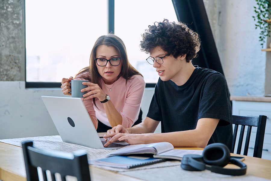 Mother helping Son with school work